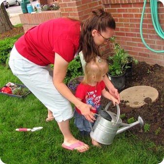 Elaine planting flowers