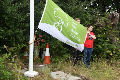 Raising the 2022 Green Flag at the Butterfly Park