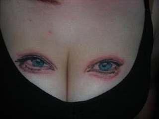 Cool Breast Tattoo with Eyes Picture