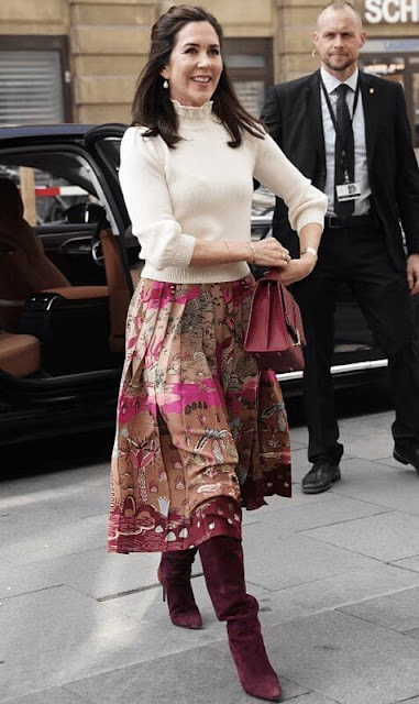 Crown Princess Mary wore an essential wool sweater by CO, and pleated printed silk crepe de chine midi skirt by Valentino