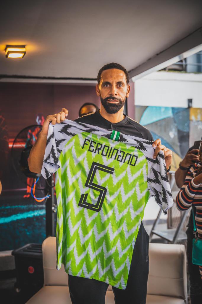 Former England and Manchester United defender, Rio Ferdinand, with a Nigeria jersey as he shows love and support for the Super Eagles