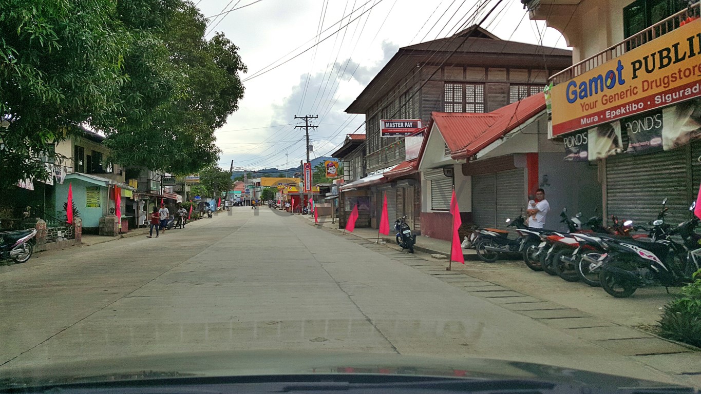 main street (highway) commercial district with old houses in Jagna Bohol