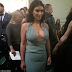 Kim Kardashian displays her cleavage in low-cut powder turquoise gown as she heads to the Valentino Haute Couture show.