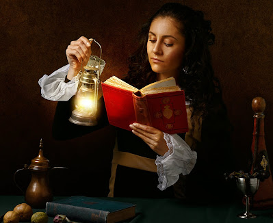 Woman holding oil lamp and reading book