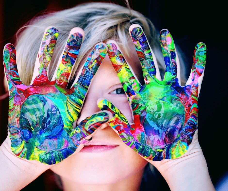 Kid with painted hands