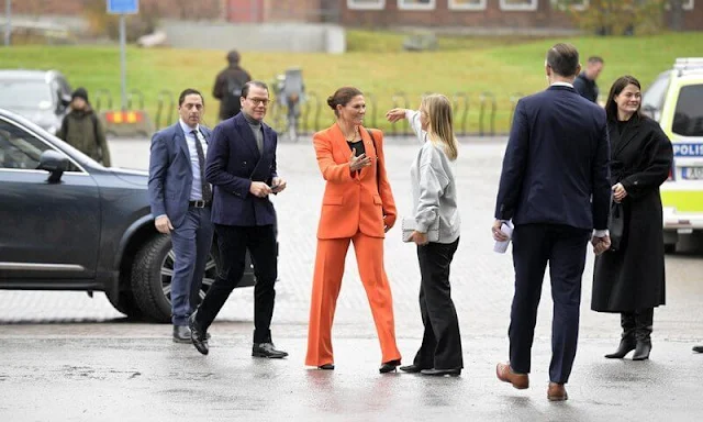 Zara orange wide-leg trousers. Crown Princess Victoria wore an orange shawl lapel blazer by Zara. Prince Daniel