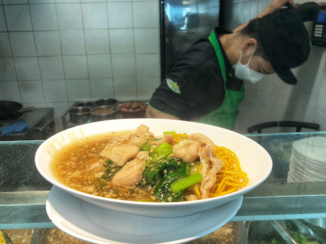 a bowl of radna moo ( ราดหน้า) in Bangkok, Thailand