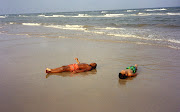 Marcus and Hollis (lying on the beach)