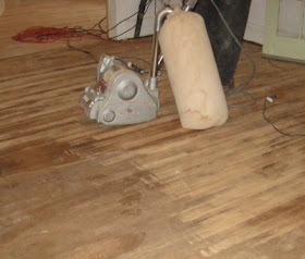 Living room floor getting sanded
