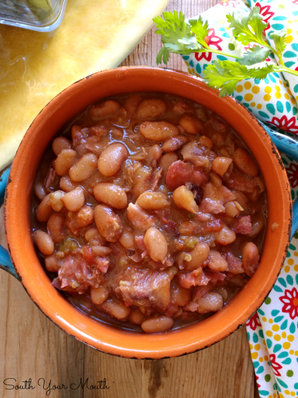 Borracho Beans! Savory, saucy pinto beans cooked low and slow with pork, spices and beer. THE PERFECT side dish recipe for your next Mexican feast!