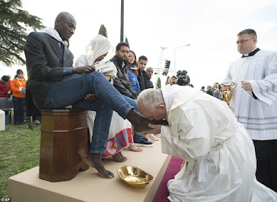 Pope Francis Washes The Feet Of Migrants In Celebration Of Easter