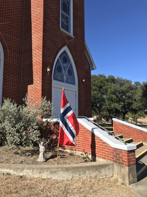 the Norwegian flag is displayed at the church as a sign of its history and heritage