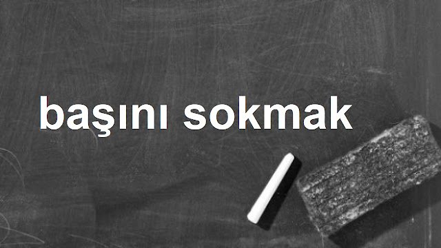 başını sokmak