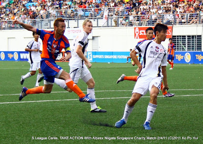 Hidetoshi Nakata hit one attempt past Emmeric Ong in the "Pray for Japan" match