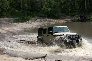 wrangler with snorkel crossing water