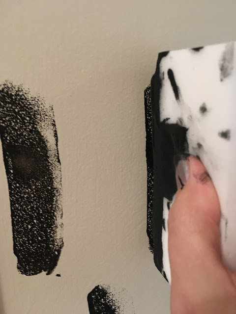 Update a boring entry way with a bright door and hand painted accent wall using a sponge! 