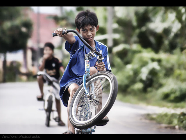 boy wheely on the bycycle