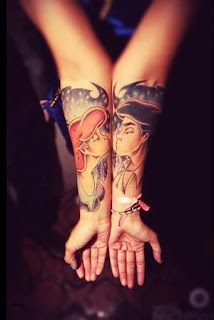 couple holding hands tattoo