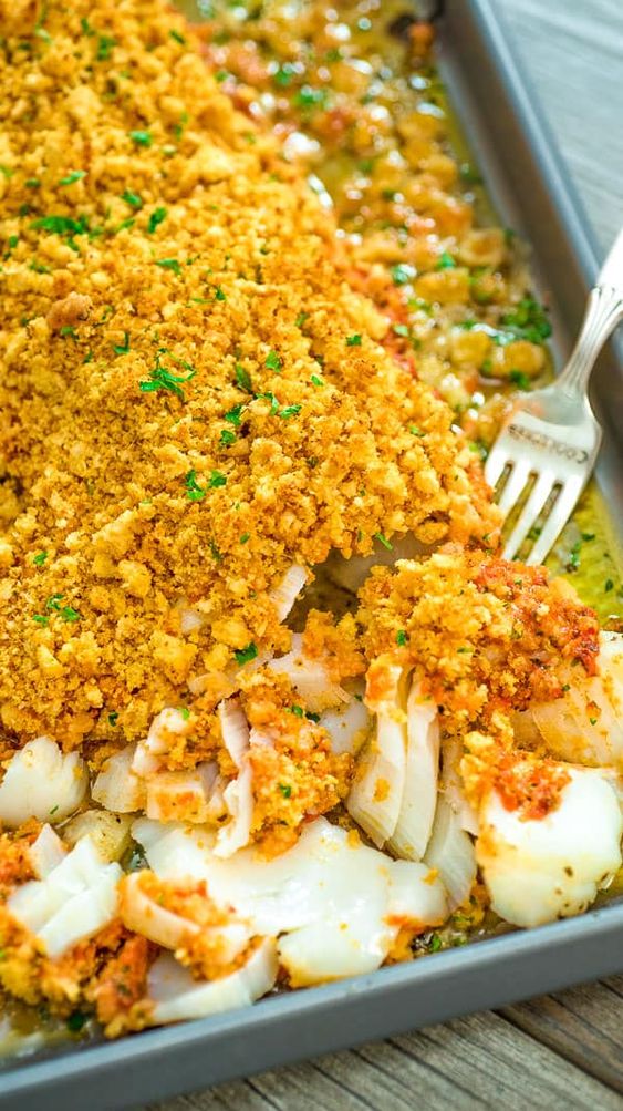 This Baked Cod recipe is truly the best you can find! Perfectly-seasoned cod, covered with a layer of roasted pepper sauce and topped with crispy breadcrumbs. #cod #fish #seafood #bakedfish #dinner #recipeoftheday