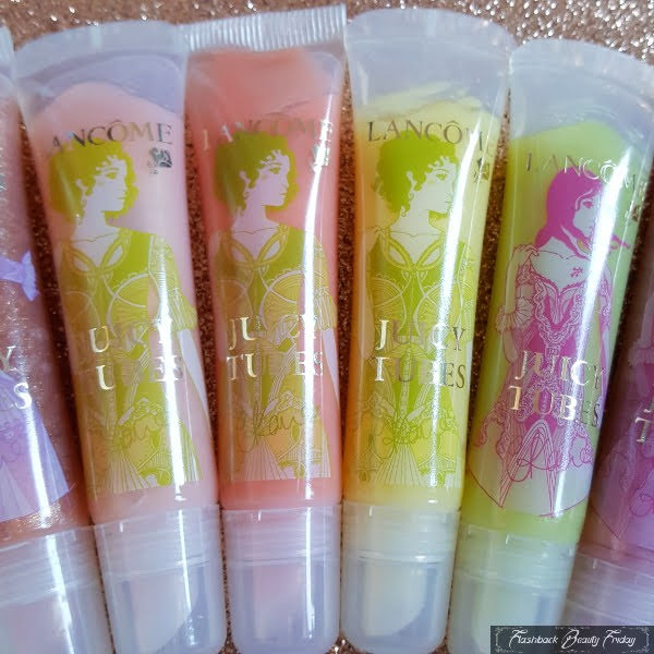 row of colourful lipgloss Lancome Juicy Tubes