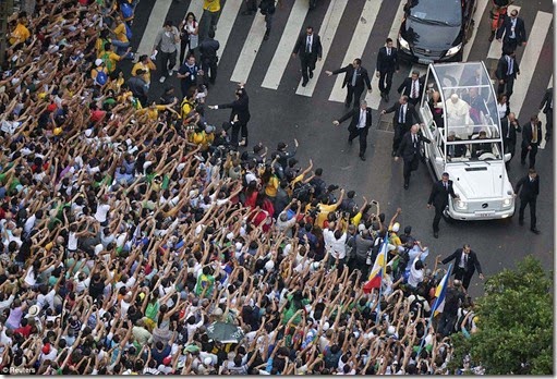 Pope Francis greets a crowd of the faithful from his Popemobile in downtown Rio de Janeiro, July 22 - Copy