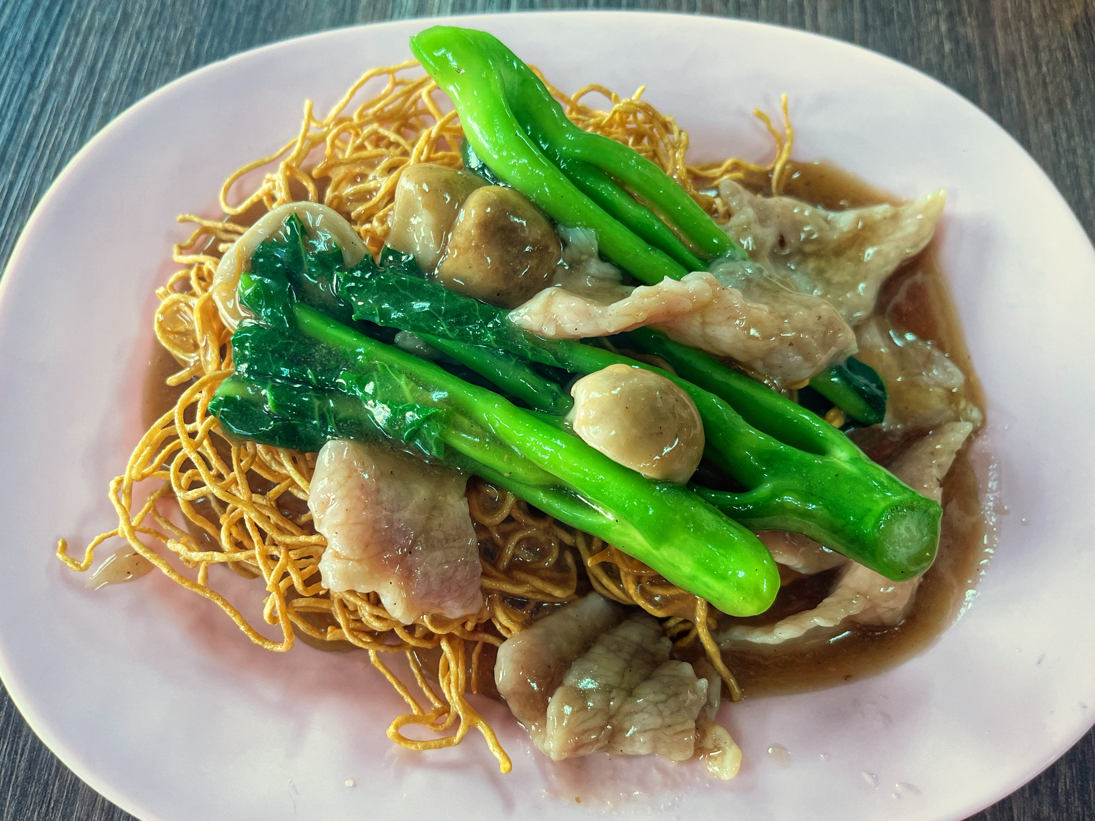 rad-nha, or crispy Thai pork noodles with gravy