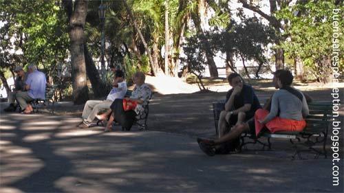 Folks relaxing in the shadow of big trees in the Parque Lezama in San Telmo, Buenos Aires