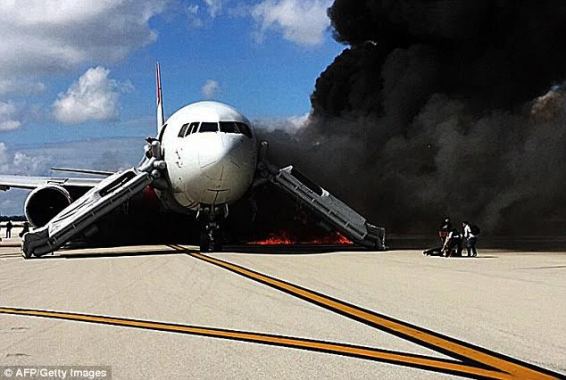 Passengers flee as plane bursts into flames on the tarmac at Fort Lauderdale airport in Florida...PICS - Classicfans 