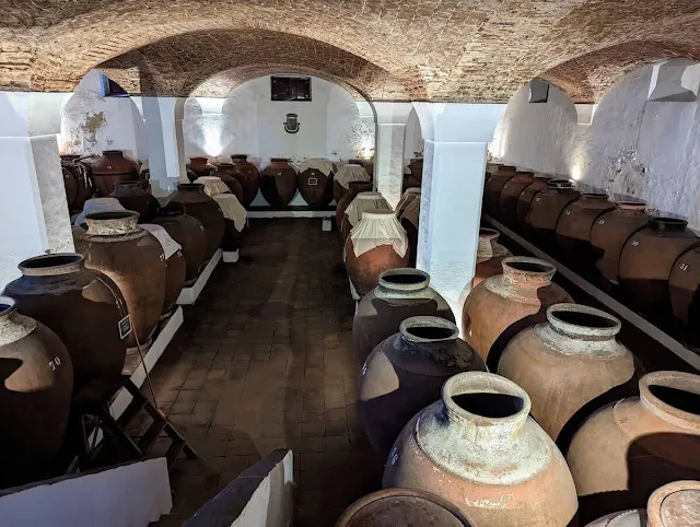 Room filled with giant clay pots at  Adega José de Sousa in Alentejo Portugal