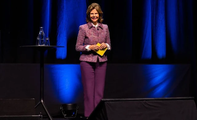 Queen Silvia wore purple multicolor tweed halifax jacket by Chanel, Newhouse. Purple, burgundy wool trousers