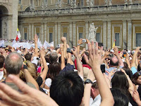 The faithful waving at the pontiff