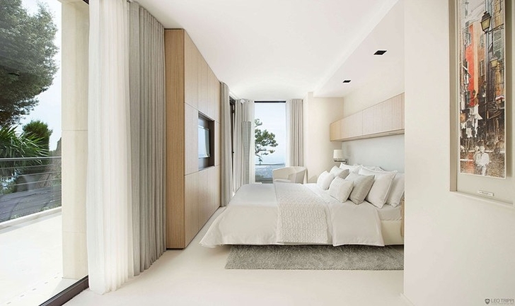 White bedroom in Modern Bayview Villa In French Riviera