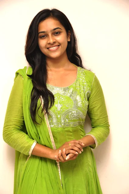 Sri Divya radiates charm in a stunning green dress, showcasing elegance and beauty in her latest captivating pictures.
