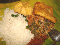 Pecel sometime spelled pecal, a Javanese salad of boiled spinach, beansprouts, yardlong beans, and krupuk, served in spicy peanut sauce. Served in a hotel in Solo (Surakarta), Central Java, Indonesia.