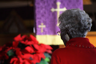 african american lady praying in church