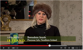 Bernadette Smyth of Precious Life, wearing a ridiculous fur hat indoors.