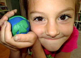Using modeling clay, Tessa created a model of the Earth with secret layers inside.