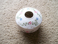 China hair receiver with painted flower design.