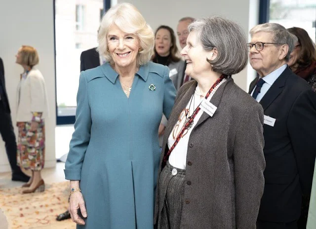 Queen Camilla wore a blue grey midi dress by Fiona Clare, and a blue coat. NHS Foundation Trust the Royal Free Hospital