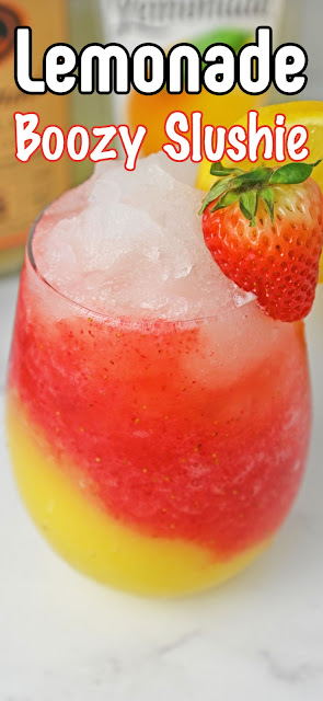 Strawberry Mango Lemonade Boozy Slushie in a stemless wine glass with a recipe title text overlay.