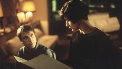 Juliette Binoche as Julie and Benoît Régent as Olivier in blue, discussing musical composition written by Julie's late husband, Directed by Krzysztof Kieslowski