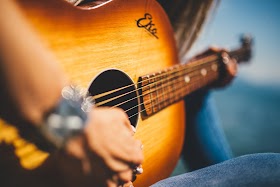 Strumming the Strings of Sorrow: Country Songs about Drug Addiction