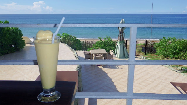 mango shake on a table with the sea as background at Mikomiko Resort in Mondragon Northern Samar