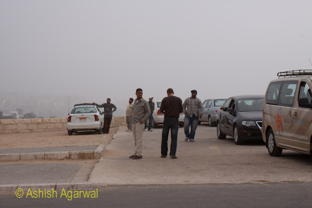 Cairo Pyramids - View of drivers roaming around their vehicles near the Great Pyramid