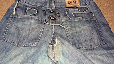 Image of a pair of jeans ripped through the crotch.