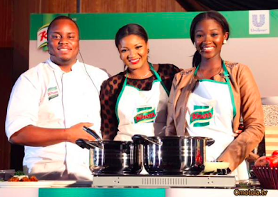 Actress Omotola Ekeinde and daughter cooking on stage