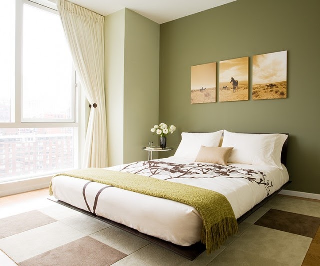 ... green accent wall is decidedly masculine in this minimal-style bedroom