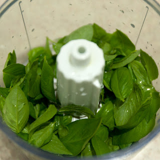 Sweet basil in a food processor