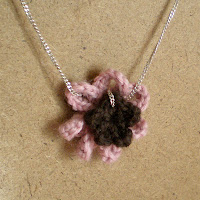 pink and purple crocheted flower pendant necklace