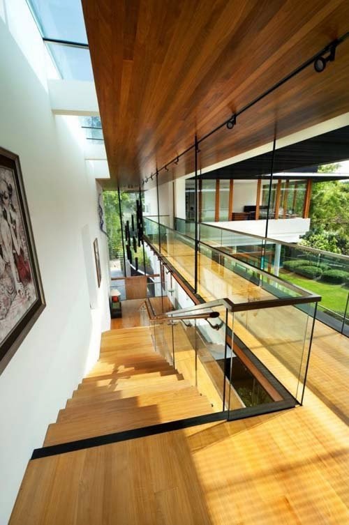 Tropical modern home design by Guz Architects